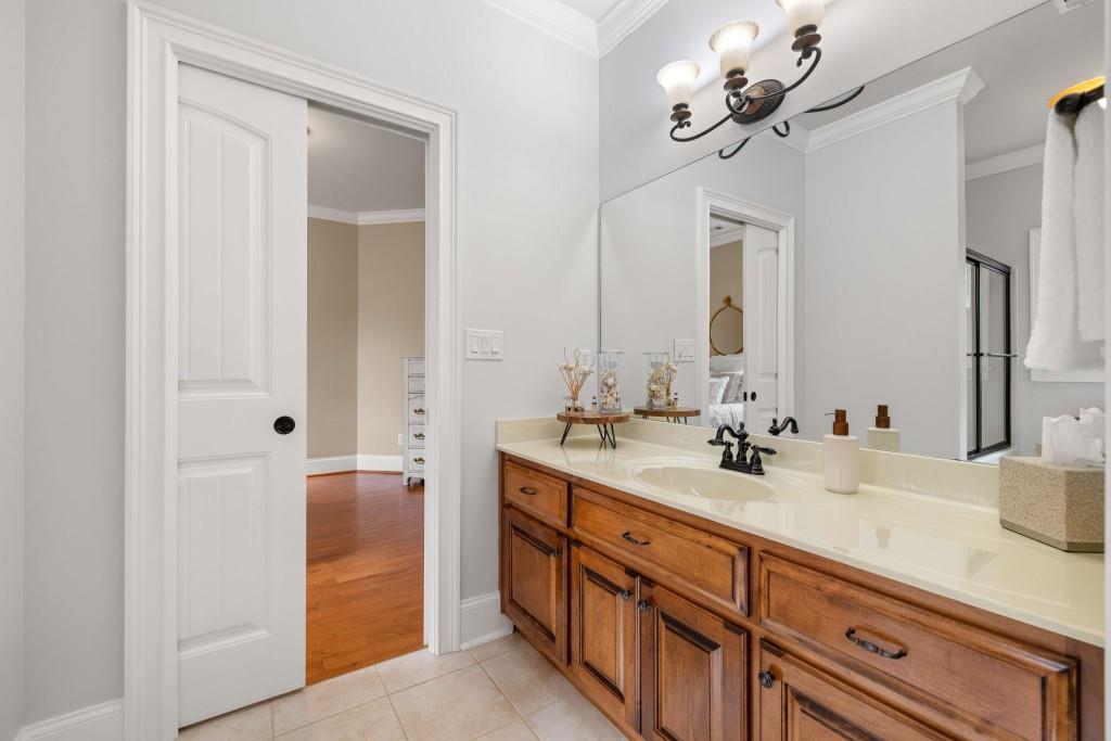 99 Madeline Anthony Road Dahlonega, GA 30533 - Photo 36 of 60 a bathroom with a double vanity sink and a mirror