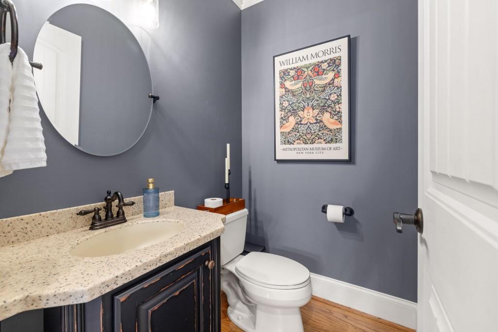 99 Madeline Anthony Road Dahlonega, GA 30533 - Photo 40 of 60 a bathroom with a granite countertop sink and a mirror