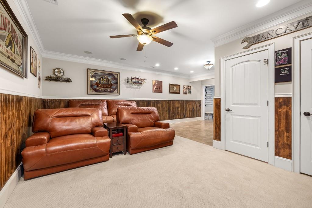 99 Madeline Anthony Road Dahlonega, GA 30533 - Photo 48 of 60 a living room with furniture ceiling fan and a ceiling fan