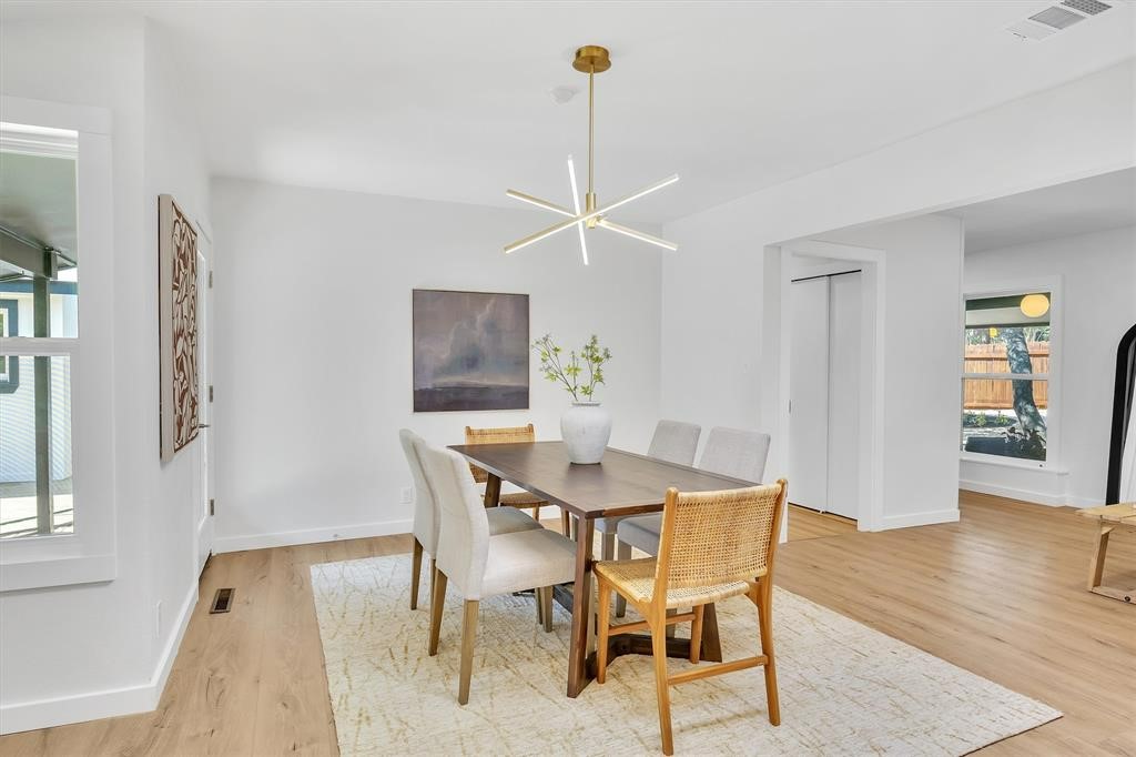 3500 Northland Drive Austin, TX 78731 - Photo 11 of 32 a view of a dining room with furniture and wooden floor
