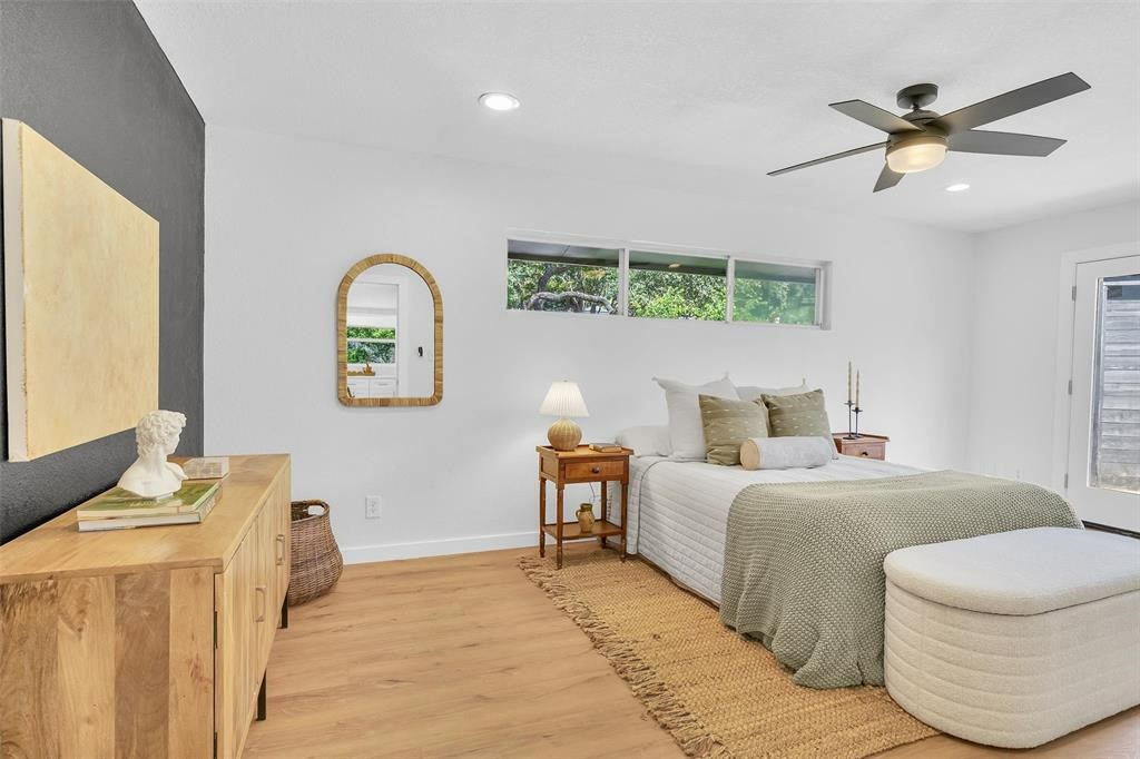 3500 Northland Drive Austin, TX 78731 - Photo 13 of 32 a bedroom with a bed and a chandelier