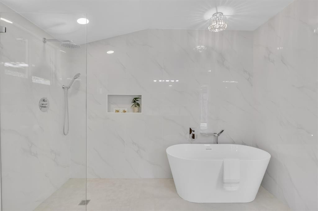 3500 Northland Drive Austin, TX 78731 - Photo 15 of 32 a bathroom with a bathtub and shower