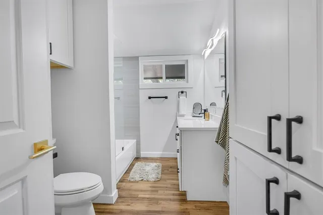 a room with furniture pool table and windows