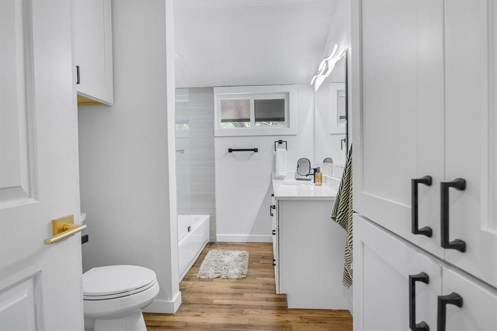 3500 Northland Drive Austin, TX 78731 - Photo 17 of 32 a bathroom with a sink a toilet and shower