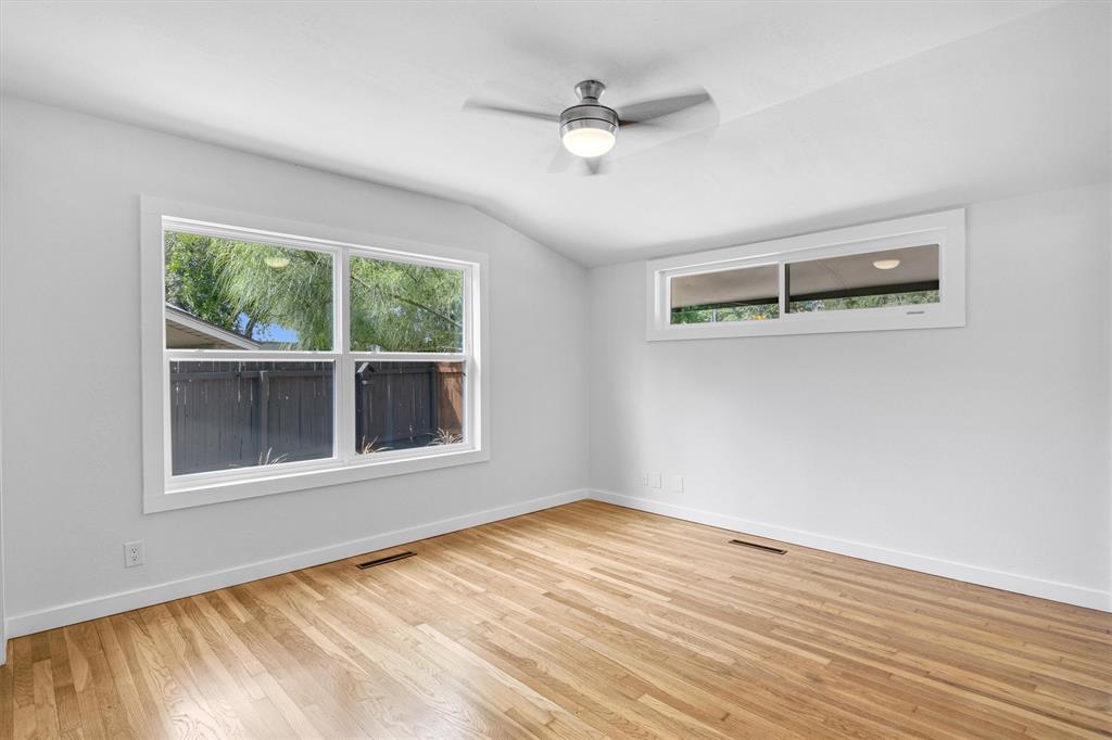 3500 Northland Drive Austin, TX 78731 - Photo 19 of 32 a view of an empty room with wooden floor and a window