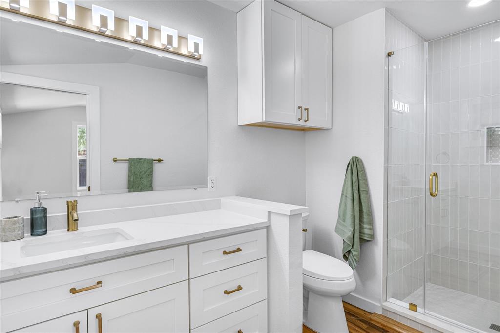 3500 Northland Drive Austin, TX 78731 - Photo 20 of 32 a bathroom with a sink a toilet and shower