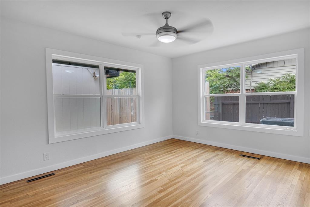 3500 Northland Drive Austin, TX 78731 - Photo 22 of 32 a view of an empty room with wooden floor and a window