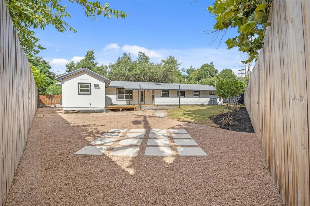 3500 Northland Drive Austin, TX 78731 - Photo 23 of 32 a front view of a house with a yard and potted plants