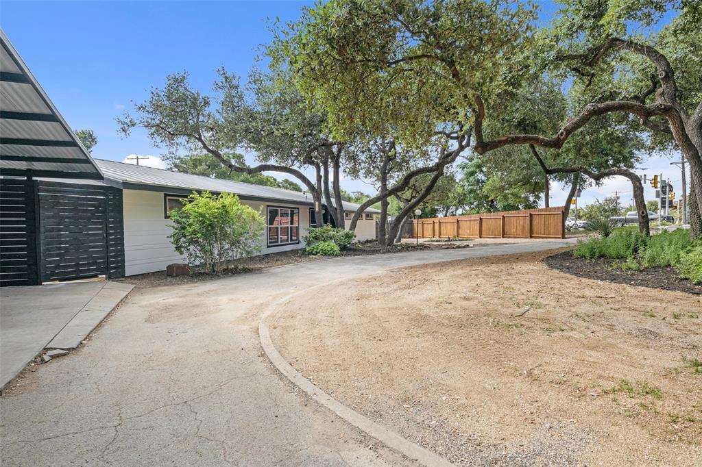 3500 Northland Drive Austin, TX 78731 - Photo 26 of 32 a view of backyard with a garden and trees
