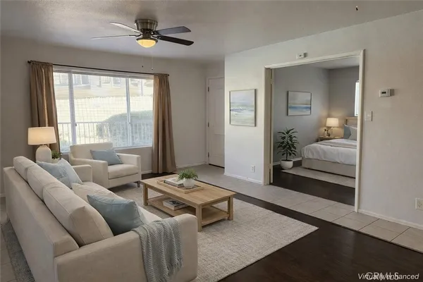 a bedroom with furniture and a window