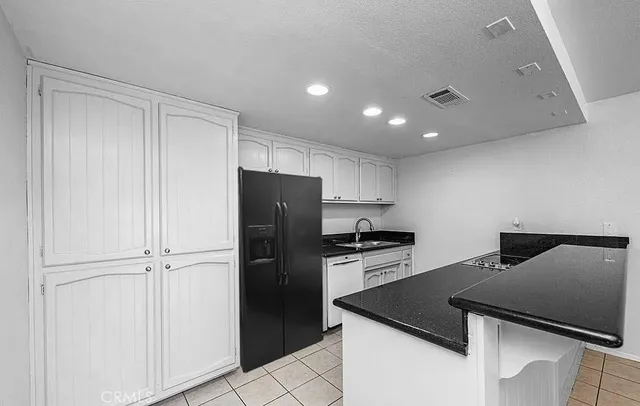 a bathroom with a sink vanity mirror and toilet
