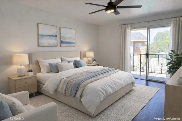 a bedroom with a large bed and a large window