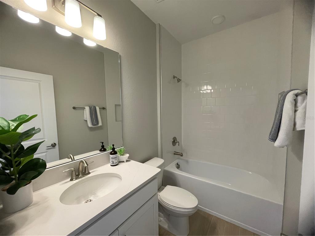 5288 Ctr Lk Rnch Boulevard St. Cloud, FL 34771 - Photo 12 of 31 a bathroom with a sink toilet and shower