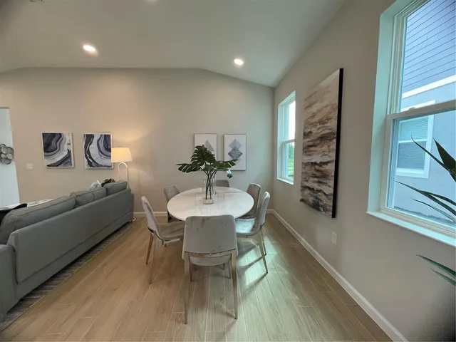 a living room with furniture a window and a table