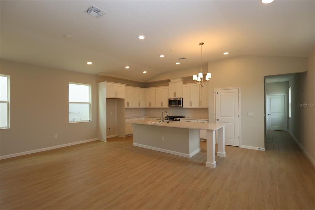 5288 Ctr Lk Rnch Boulevard St. Cloud, FL 34771 - Photo 5 of 31 a large kitchen with a sink stainless steel appliances and window
