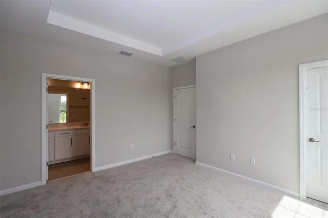 a view of an empty room and fire place