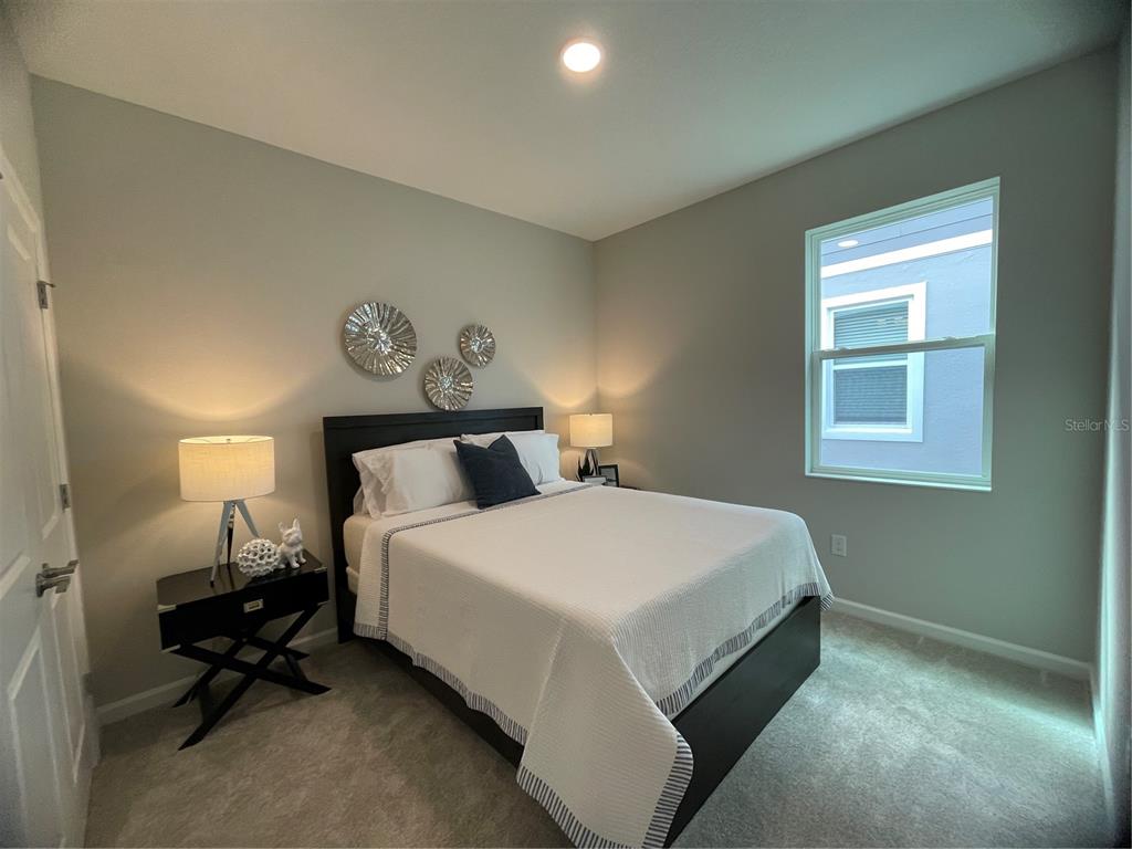 5288 Ctr Lk Rnch Boulevard St. Cloud, FL 34771 - Photo 10 of 31 a bedroom with a bed and a window