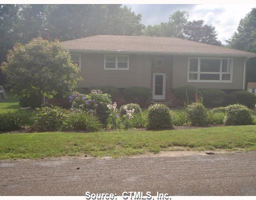 10 Roaring Brook Road Prospect, CT 06712 - Photo 1 of 1 a front view of a house with garden