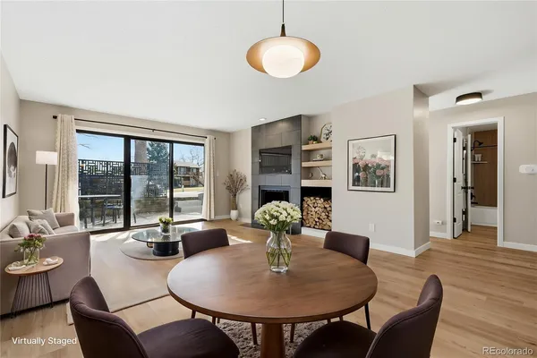 a view of a dining room with furniture large windows and wooden floor