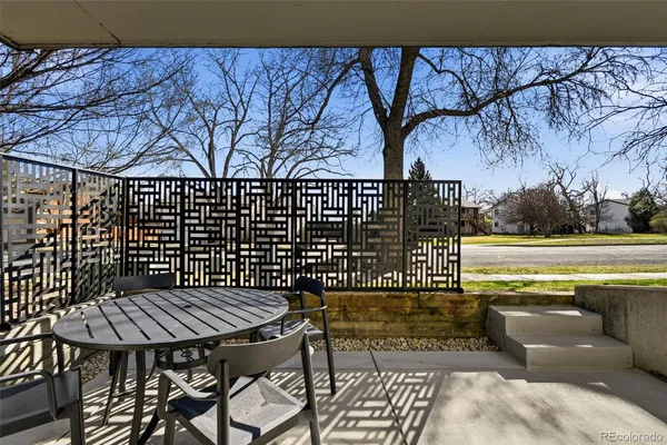 a terrace of a house with outdoor seating
