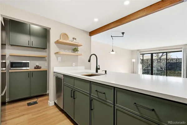 a kitchen with a sink and cabinets