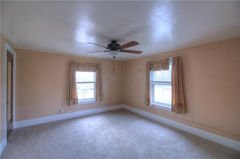 2248 Mercer Road New Brighton, PA 15066 - Photo 16 of 25 The Master Bedroom is generously sized with great natural light and new carpeting, updated ceiling fan.