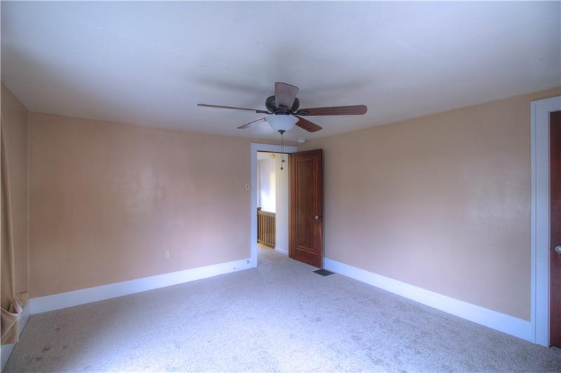 2248 Mercer Road New Brighton, PA 15066 - Photo 17 of 25 Another view of the Master Bedroom featuring crisp white trim, new carpeting, updated ceiling fan and walk-in-closet at right.