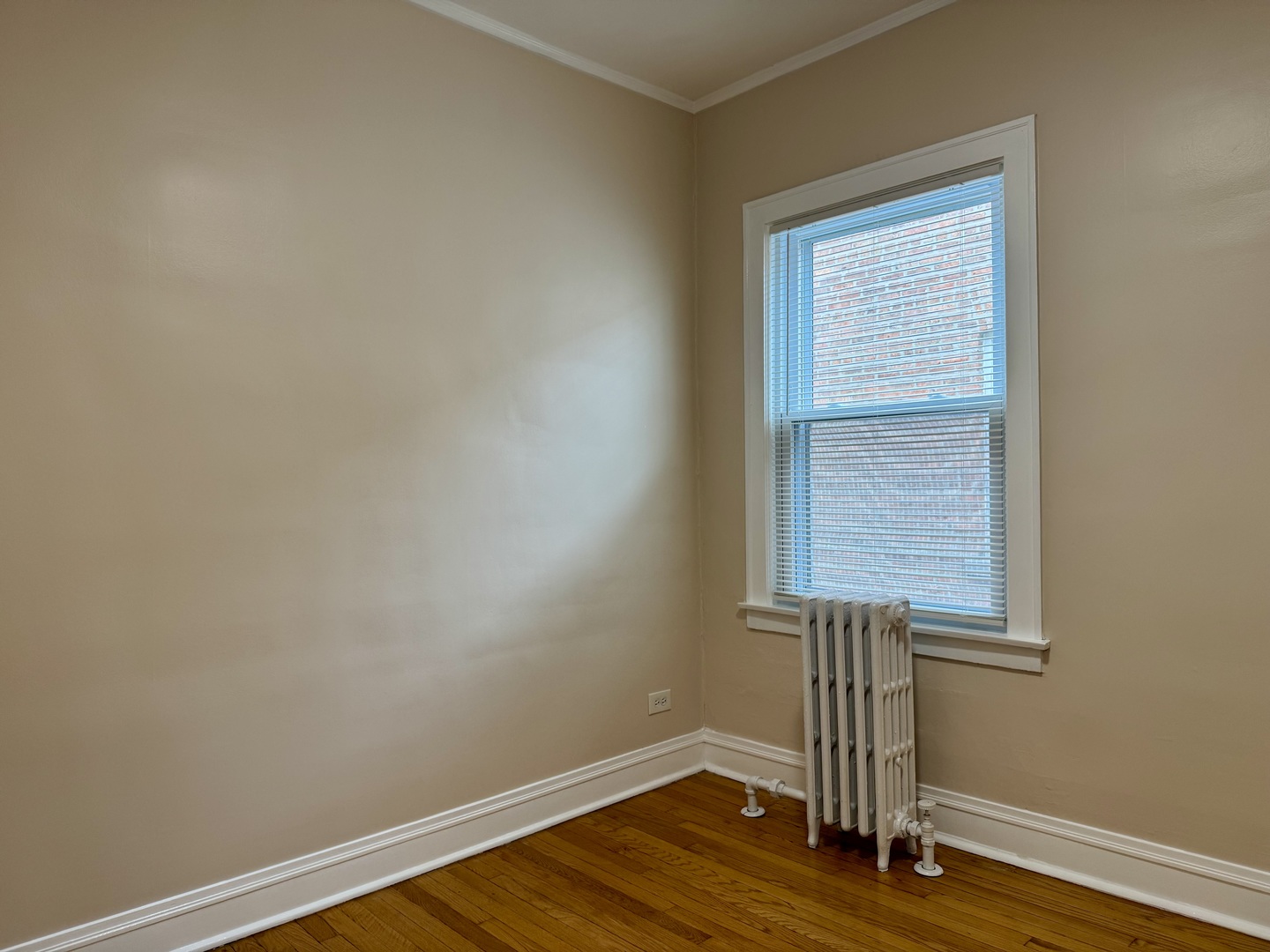 2125 Wesley Avenue, Unit 2 Berwyn, IL 60402 - Photo 13 of 26 a view of empty room with wooden floor and fan