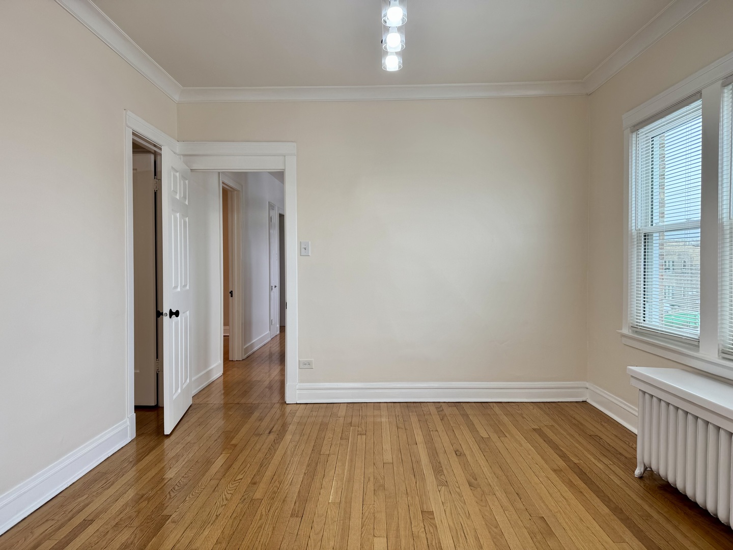 2125 Wesley Avenue, Unit 2 Berwyn, IL 60402 - Photo 10 of 26 wooden floor in an empty room with a window
