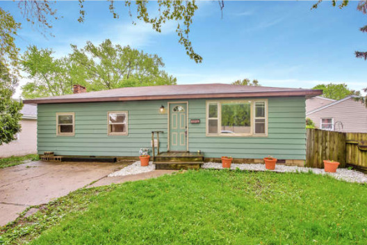 1529 Lewis Street DeKalb, IL 60115 - Photo 1 of 16 a backyard of a house with lots of green space