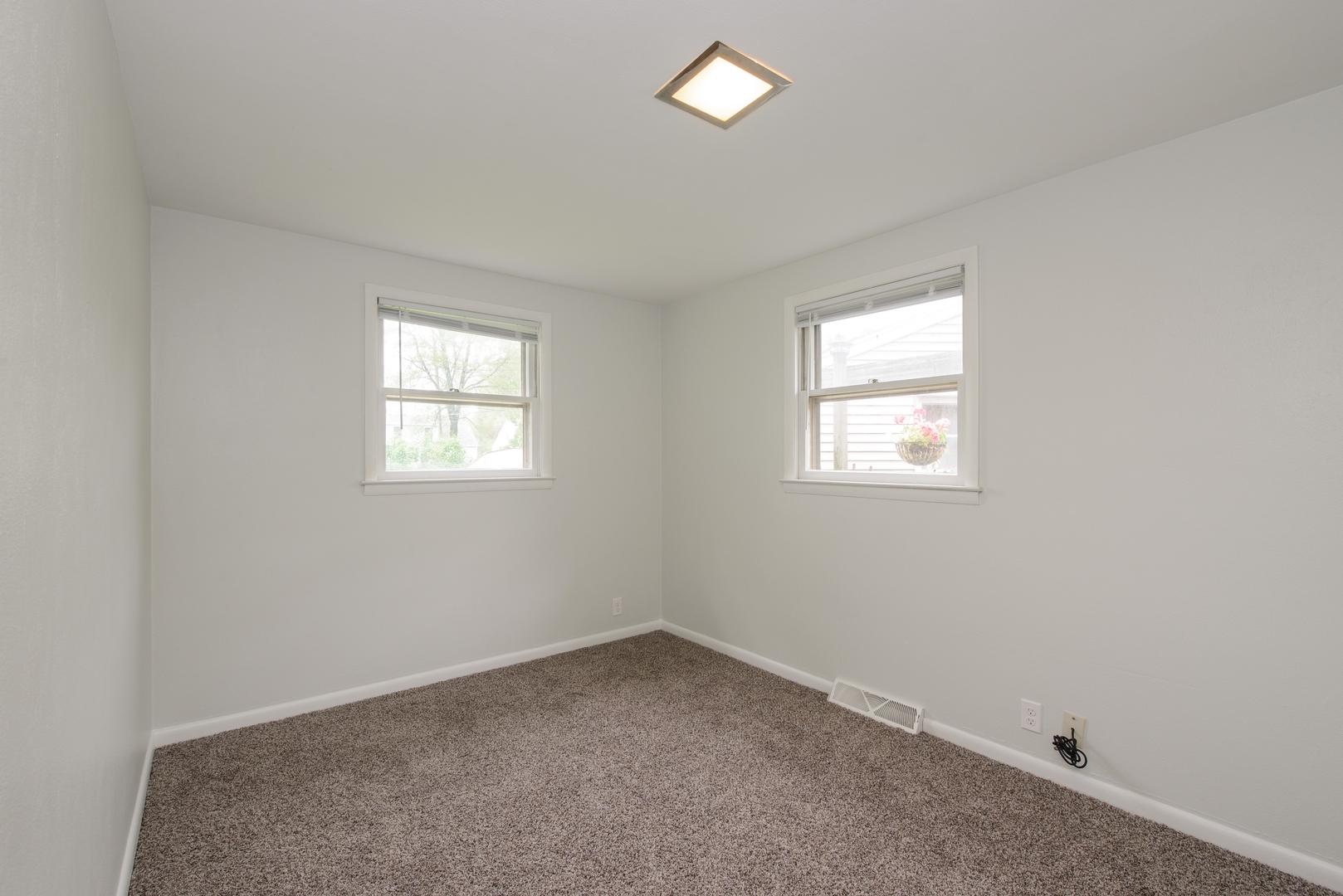 1529 Lewis Street DeKalb, IL 60115 - Photo 11 of 16 an empty room with windows