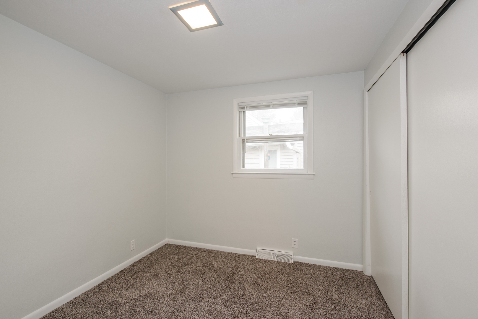 1529 Lewis Street DeKalb, IL 60115 - Photo 12 of 16 an empty room with windows