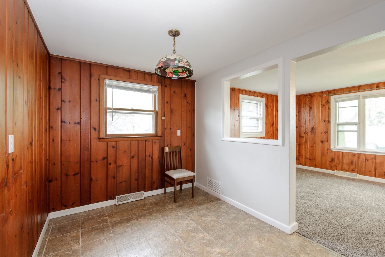 1529 Lewis Street DeKalb, IL 60115 - Photo 6 of 16 a view of a room with windows and chandelier