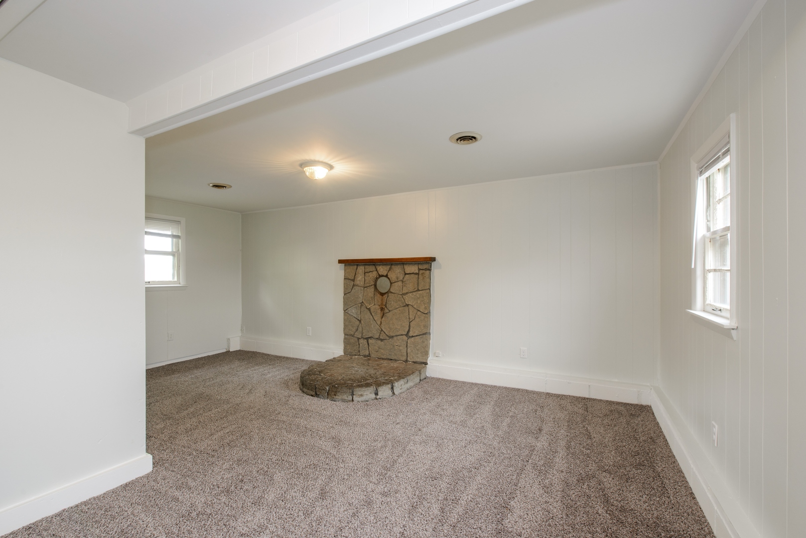 1529 Lewis Street DeKalb, IL 60115 - Photo 7 of 16 an empty room with windows