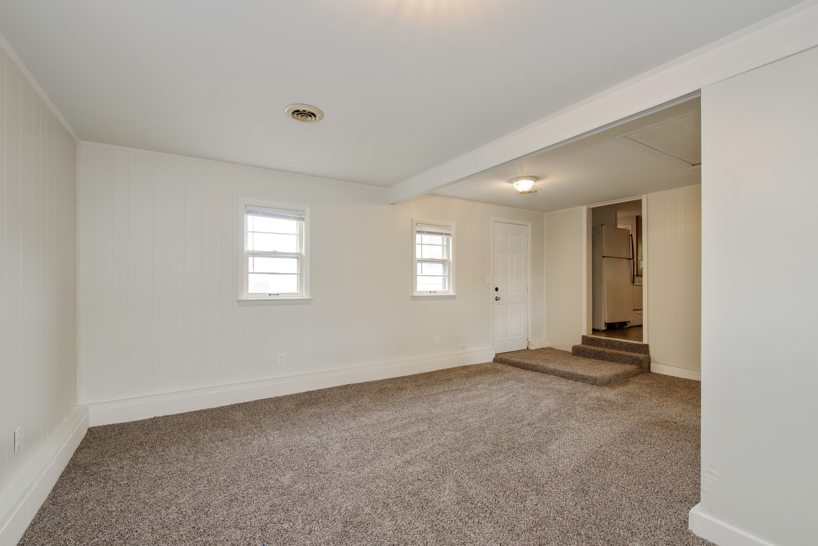 1529 Lewis Street DeKalb, IL 60115 - Photo 9 of 16 a view of an empty room with a window