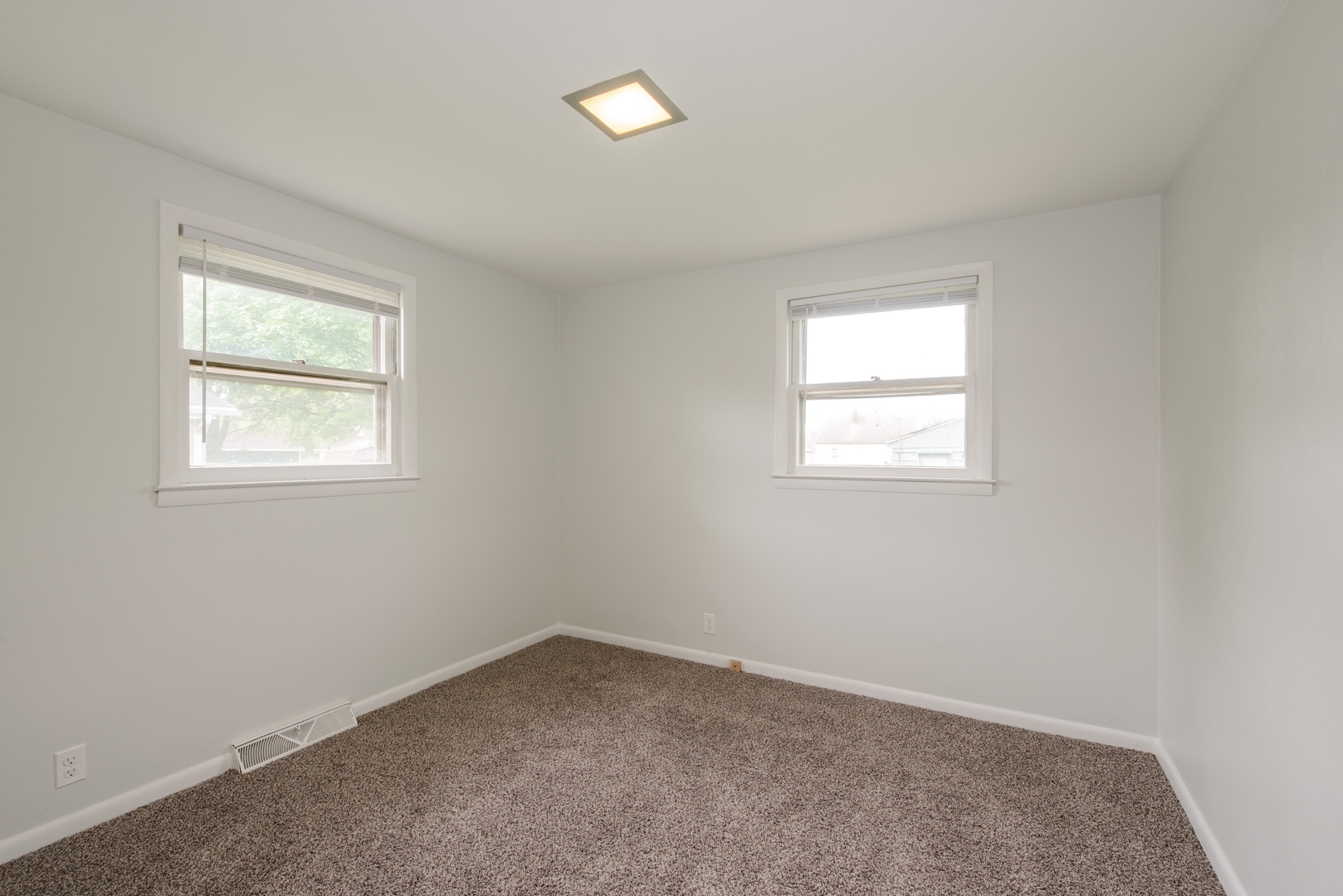 1529 Lewis Street DeKalb, IL 60115 - Photo 10 of 16 an empty room with a window