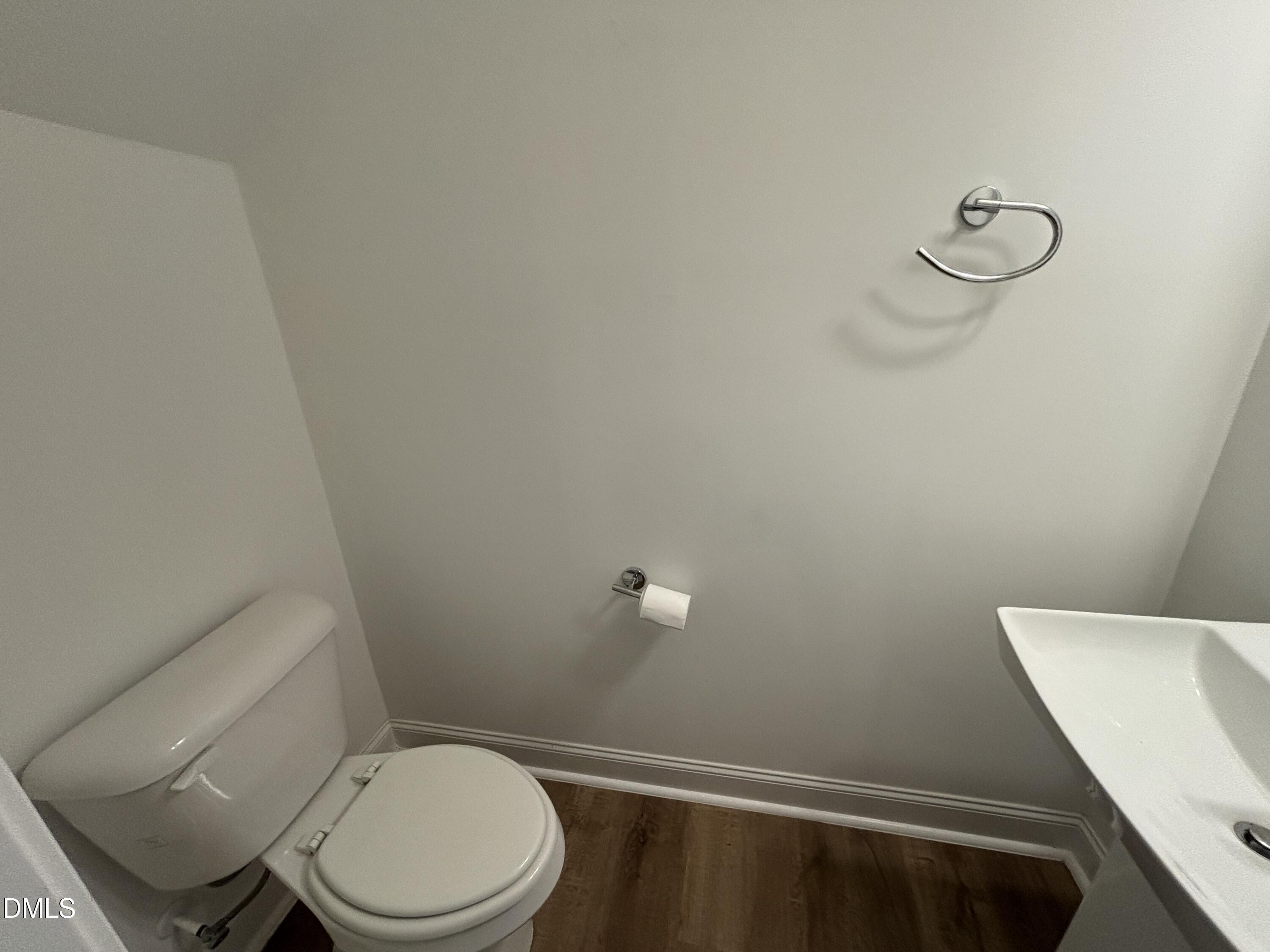 5710 Parker Pnes Court Raleigh, NC 27609 - Photo 24 of 78 a white toilet sitting next to a white walls