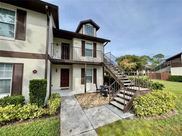 front view of a house with a small yard