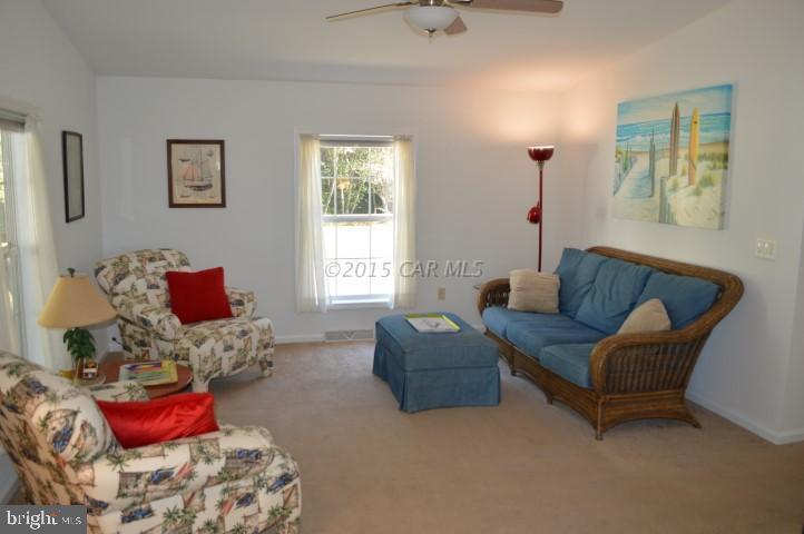 35354 Poplar Neck Road Willards, MD 21874 - Photo 3 of 17 a living room with furniture rug and window