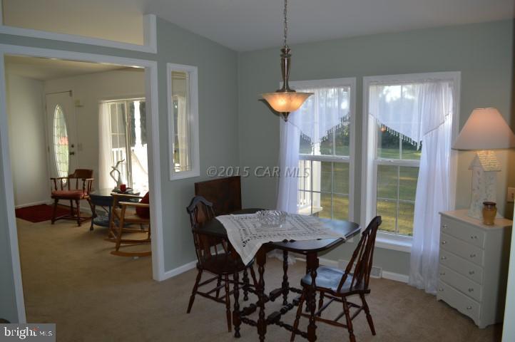 35354 Poplar Neck Road Willards, MD 21874 - Photo 5 of 17 a view of a dining room with furniture window and outside view