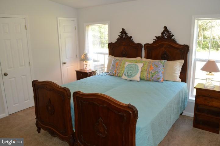 35354 Poplar Neck Road Willards, MD 21874 - Photo 8 of 17 a bed sitting in a bedroom next to a window