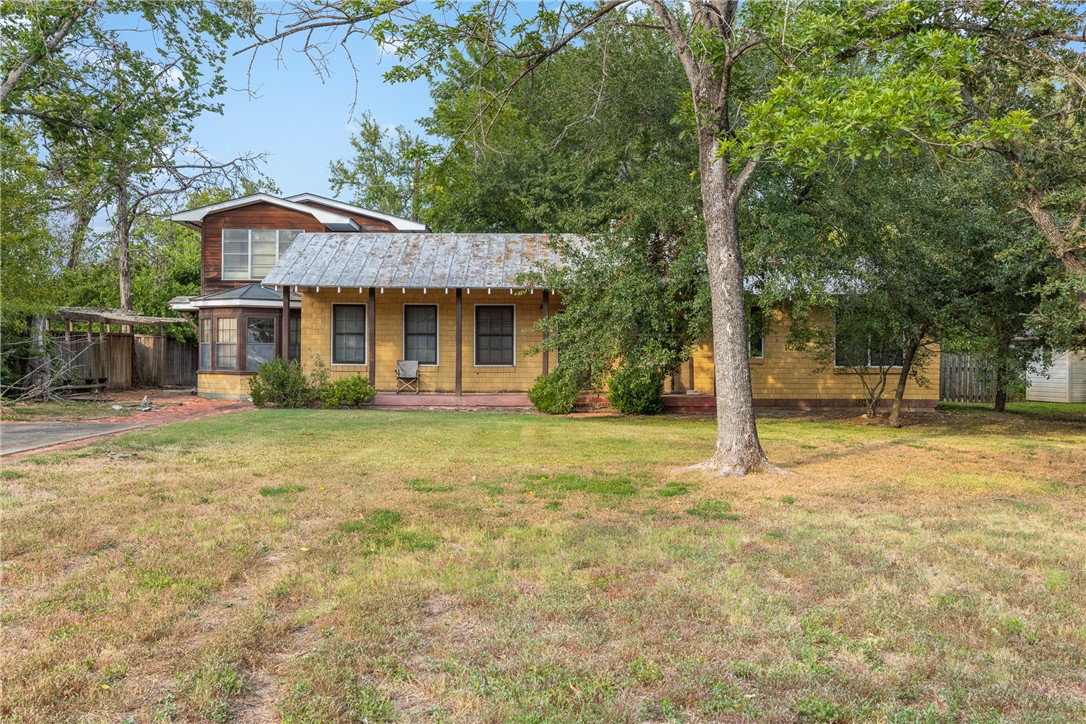 a house with trees in the background
