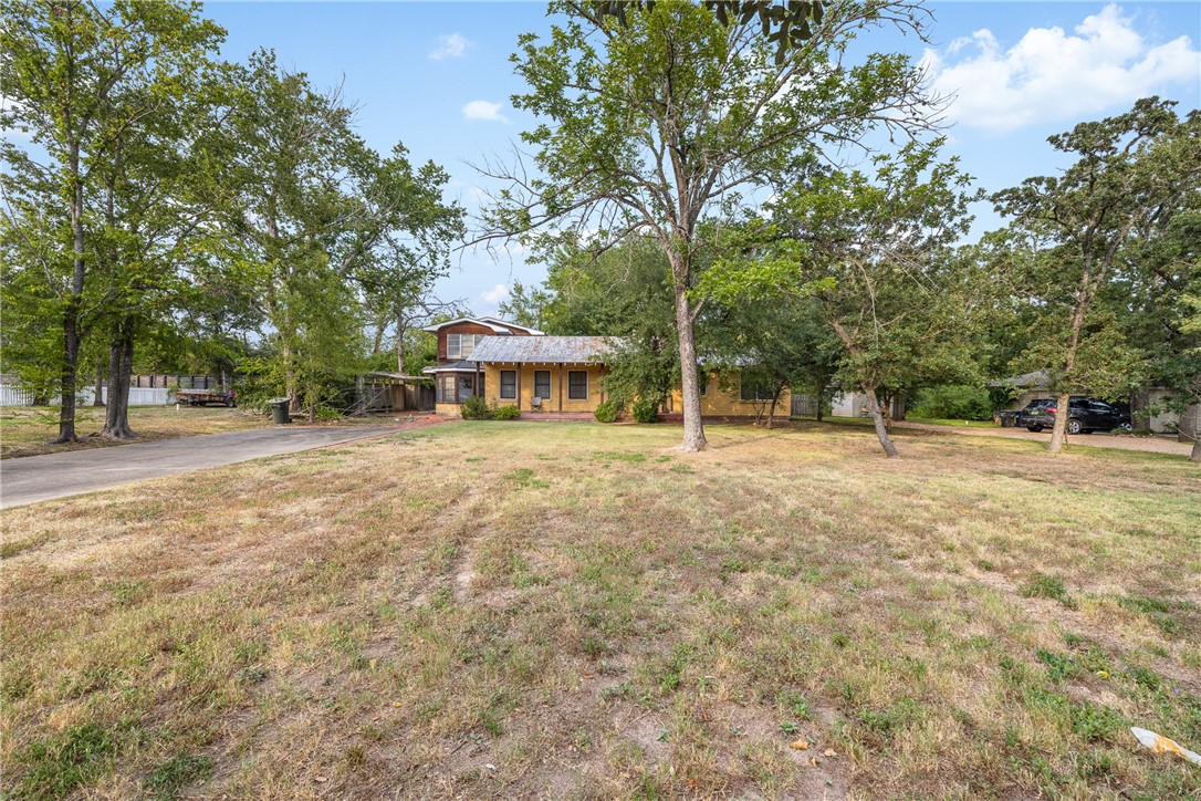309 Pershing Avenue College Station, TX 77840 - Photo 2 of 21 a house with trees in front of it