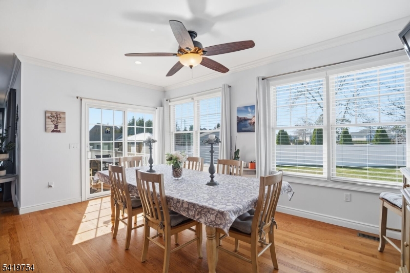 663 Harbor Road Brick, NJ 08724 - Photo 12 of 46 a view of a dining room with furniture window and wooden floor