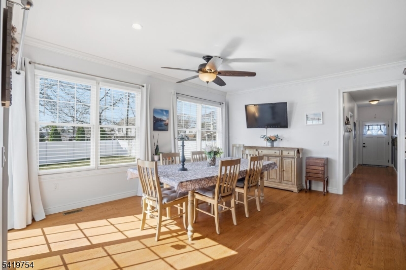 663 Harbor Road Brick, NJ 08724 - Photo 13 of 46 a view of a dining room with furniture window and wooden floor
