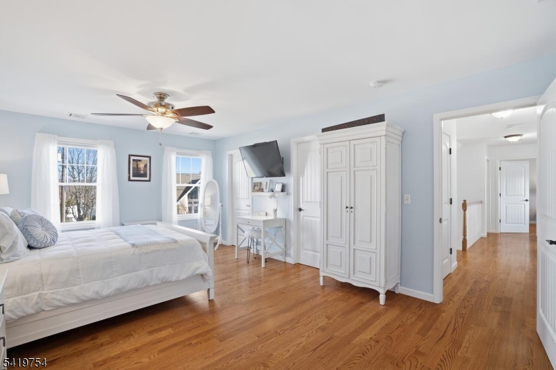 663 Harbor Road Brick, NJ 08724 - Photo 23 of 46 a bedroom with a bed and wooden floor