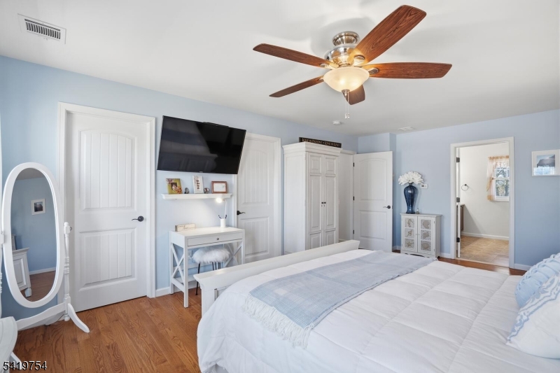 663 Harbor Road Brick, NJ 08724 - Photo 24 of 46 a bedroom with a bed and a flat screen tv