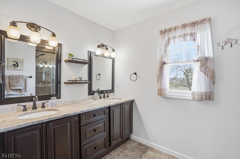 663 Harbor Road Brick, NJ 08724 - Photo 25 of 46 a bathroom with a granite countertop sink mirror and double