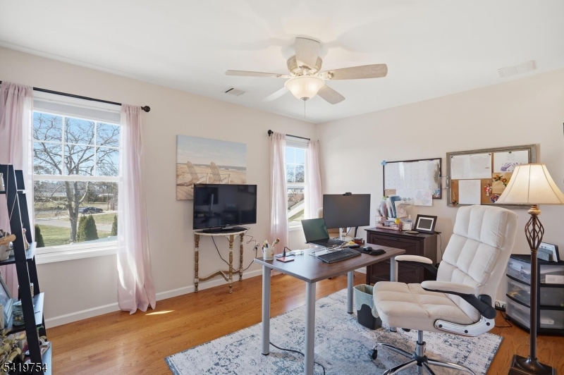 663 Harbor Road Brick, NJ 08724 - Photo 27 of 46 a living room with furniture a flat screen tv and a window
