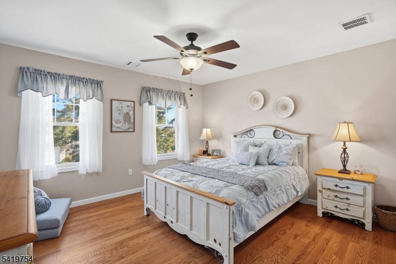 663 Harbor Road Brick, NJ 08724 - Photo 30 of 46 a bedroom with a bed and a window